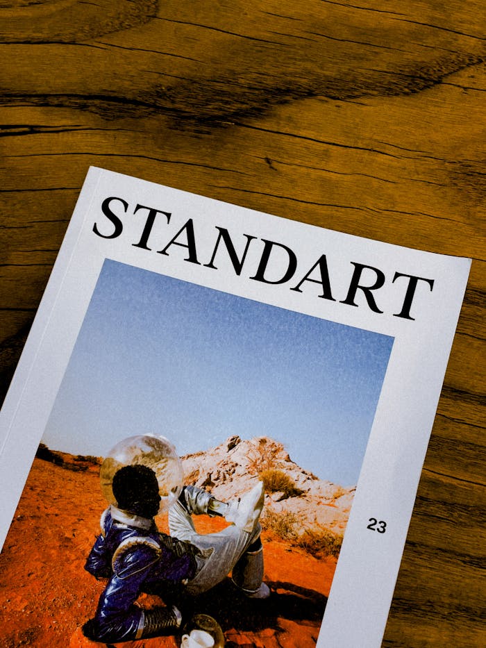Close-up of Standart magazine cover placed on a wooden table surface.